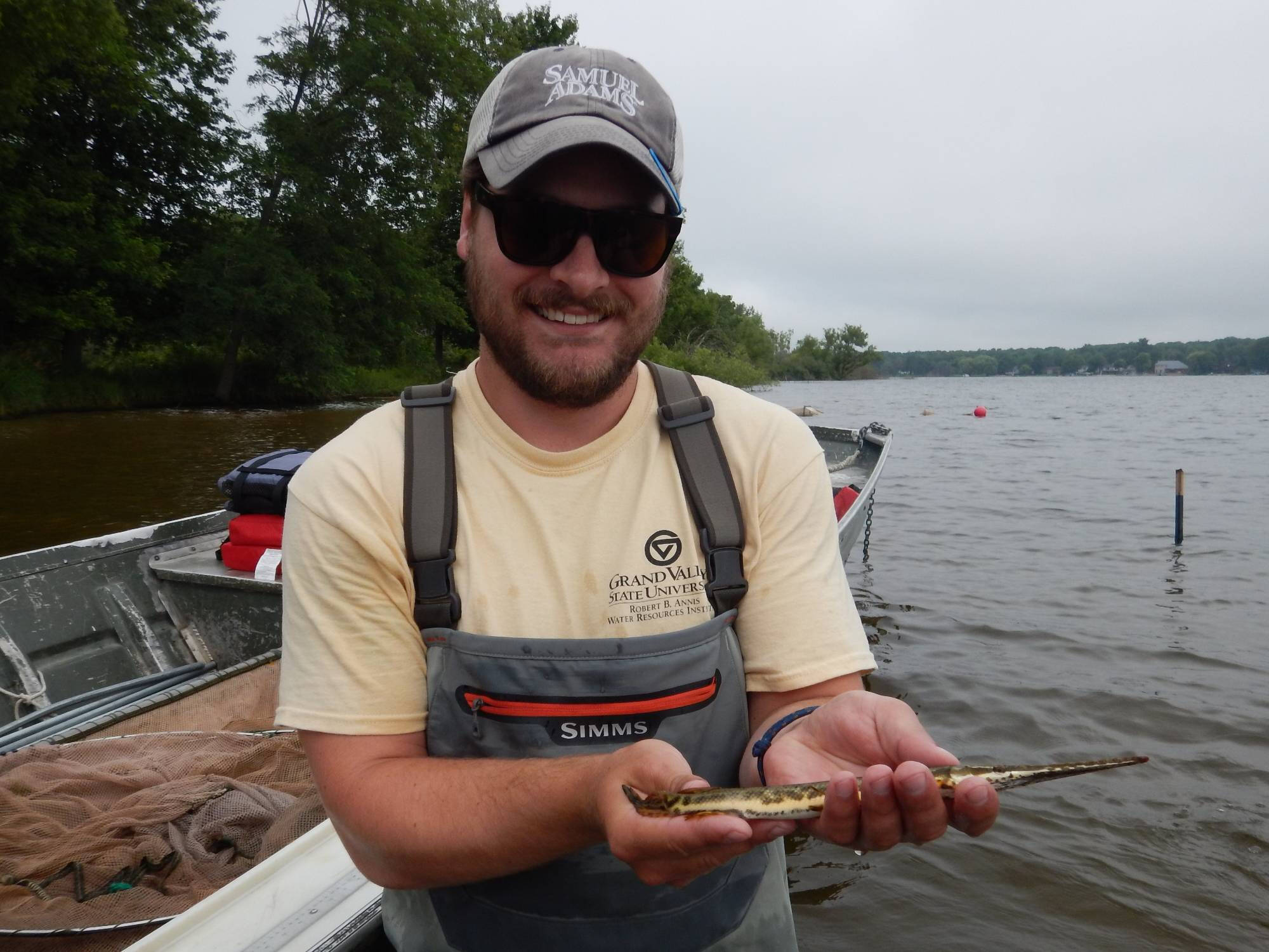 Bert Carey displays a juvenile gar for the camera.